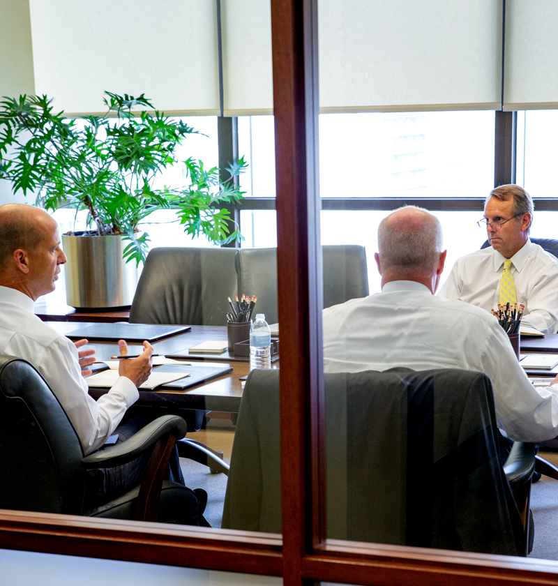 Portfolio manager discussing asset allocation strategy with a client.