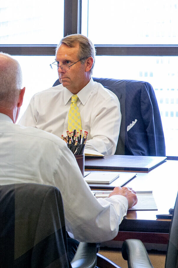 Portfolio manager discussing asset allocation strategy with a client.